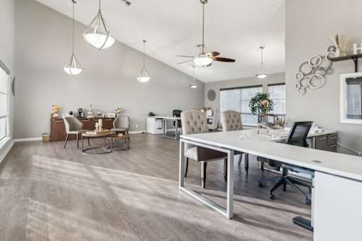 Leasing Center office with a long white desk and chairs at The Bay Club, Corpus Christi, 78418