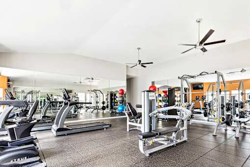 A Gym with Equipment at Flats on Chapel Apartments, Texas