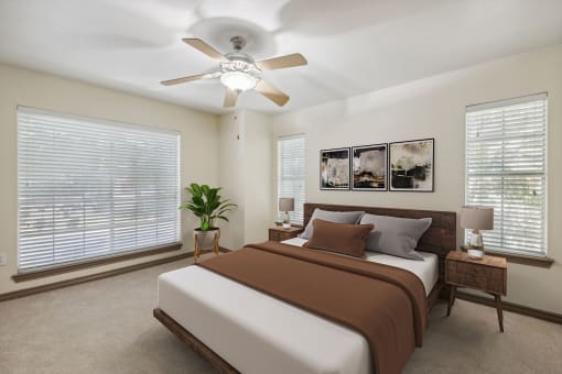 a bedroom with a bed and a ceiling fan
