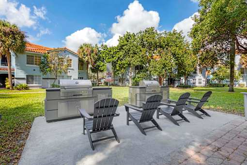 Outdoor grilling station with lounge chairs