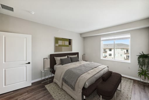 a bedroom with a large bed and a window at SoRoc On Maine, Rochester Minnesota