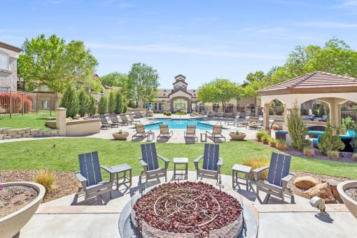 an outdoor patio with chairs and a pool at Altezza High Desert, New Mexico