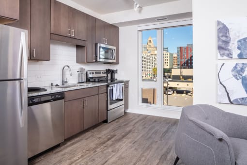 a kitchen with a view of the city and a window at Maven on Broadway, Minnesota, 55904