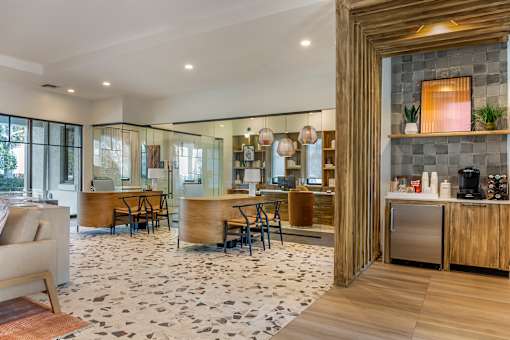 A modern kitchen with a black and white floor.