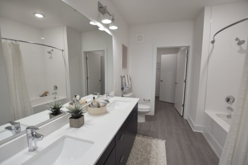Bathroom with double sink at The Maven, Georgia, 30024