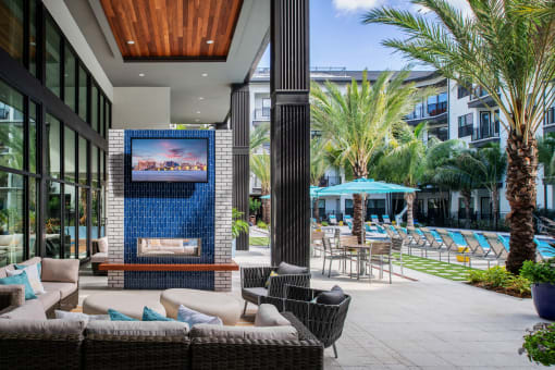 Outdoor lounge area with TV  | District at Rosemary at The District at Rosemary, Sarasota, FL