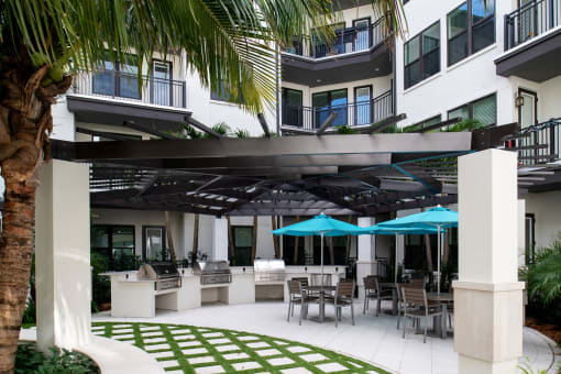Outdoor patio with grills  | District at Rosemary at The District at Rosemary, Sarasota, FL