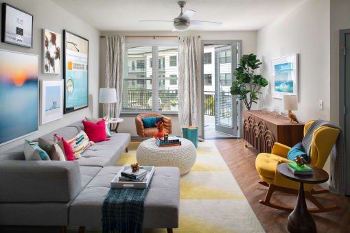 Living room with patio access  | District at Rosemary at The District at Rosemary, Florida
