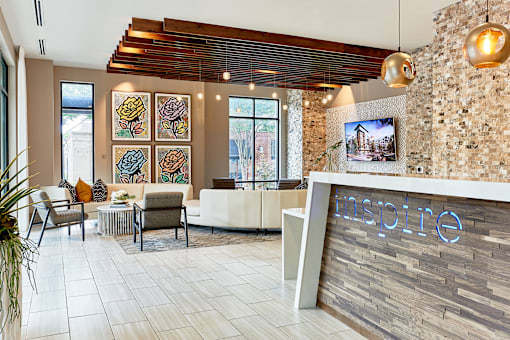 A reception area with a sign that says inspire.