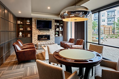 A modern living room with a fireplace and a television.