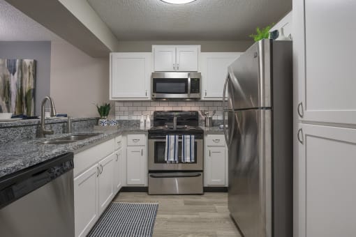 Kitchen with stainless steel appliances at Saddleworth Green, Ocala