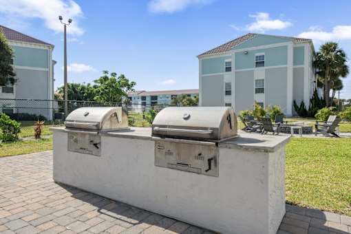 A white concrete structure with two satellite dishes on top.