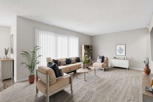 A living room with a beige sofa, a grey rug, and a white wall.