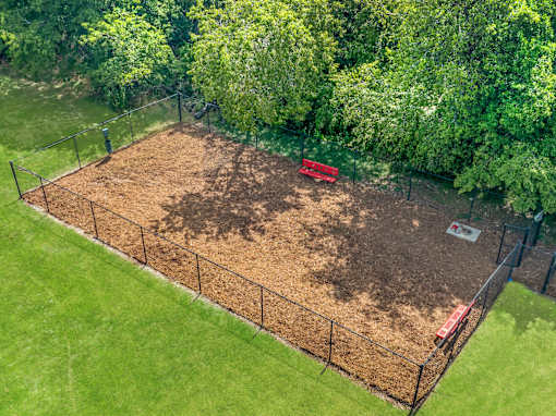 A dog park surrounded by a fence