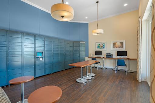 A room with a blue wall and a wooden table.