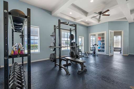 A spacious home gym with a variety of exercise equipment.