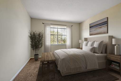 A bedroom with a large bed and a potted plant.