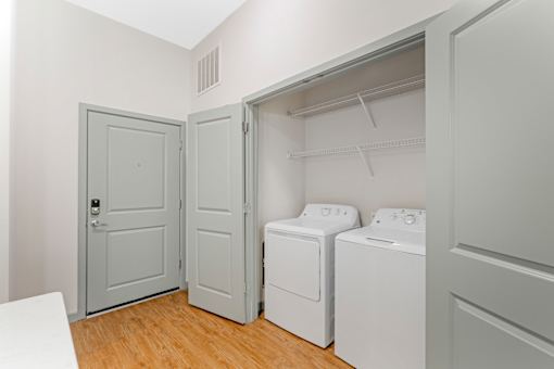 A laundry room with a washer and dryer.