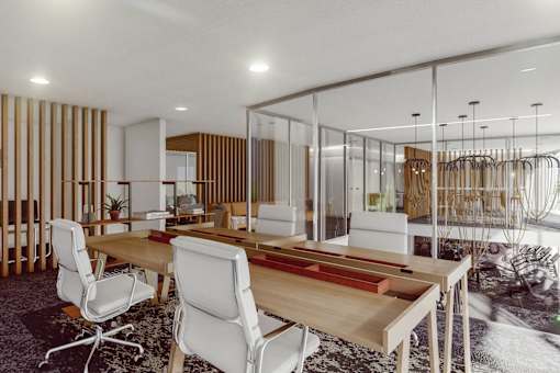 A modern dining room with a glass partition and a wooden table. at Element, Tampa, FL