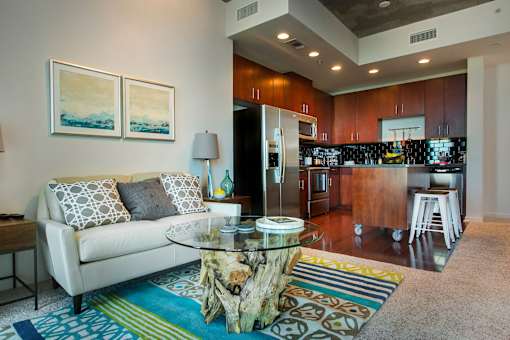 A modern living room with a white couch and a coffee table. at Element, Tampa, Florida