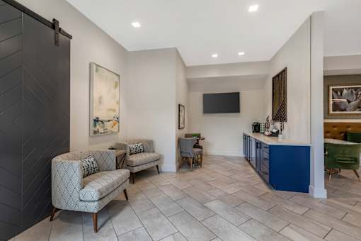 A living room with a grey sofa and a blue cabinet.