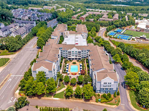 A large building with a pool in the middle of it.