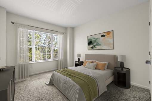 A bedroom with a large bed and a painting on the wall.