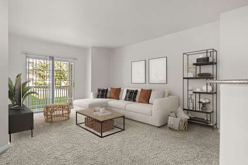 A living room with a white couch, a coffee table, and a plant.
