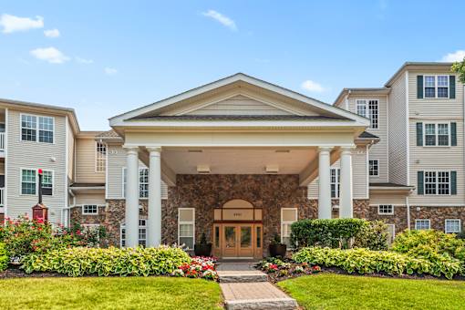 A building with a stone facade and a large front door.