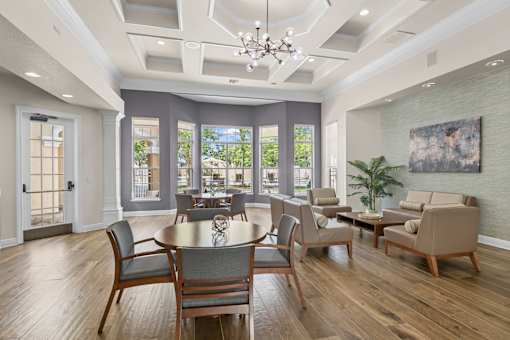 A dining room with a table set for six.