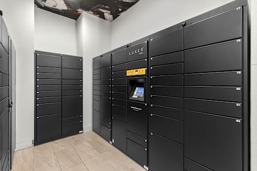 A row of black lockers with the word "LUXURY" on the top.