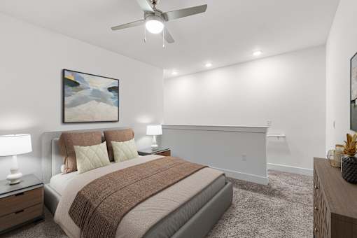 A bedroom with a bed, nightstands, and a painting on the wall.