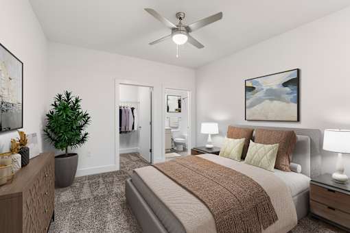 A bedroom with a bed, a ceiling fan, and a painting on the wall.