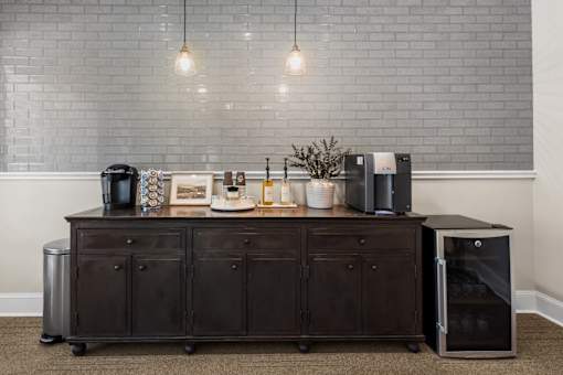 A kitchen island with a coffee maker, toaster, and other items on it.