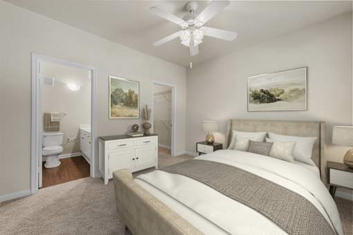 A bedroom with a large bed and a ceiling fan.