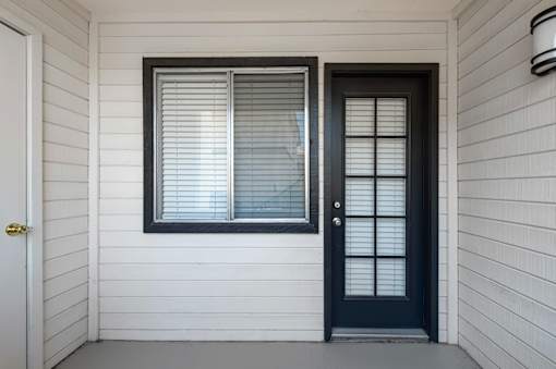 A black door is on the right and a white door is on the left.