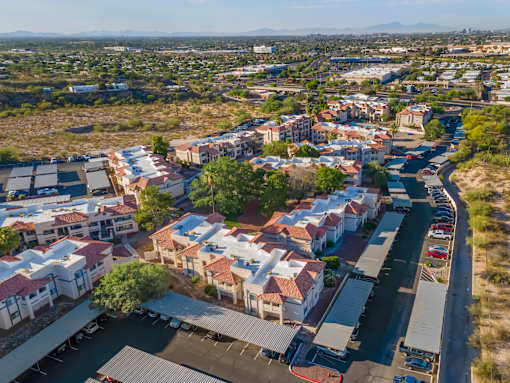 A small town with a lot of buildings and a parking lot.