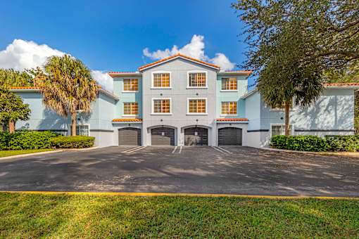 Exterior view of the apartment buildings showcasing the built-in garages available