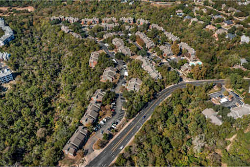Road with houses on both sides at Great Hills, Austin Texas