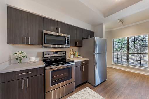Large Island Kitchen With Custom Cabinetry at Sedona Springs, Texas