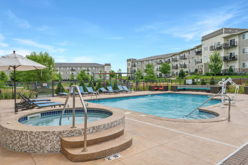 a resort-style swimming pool and spa at SoRoc on Maine in Rochester, MN