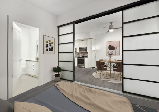 a bedroom with a bed and sliding doors that open to the kitchen and dining area  at SLX Atlanta, Georgia, 30341