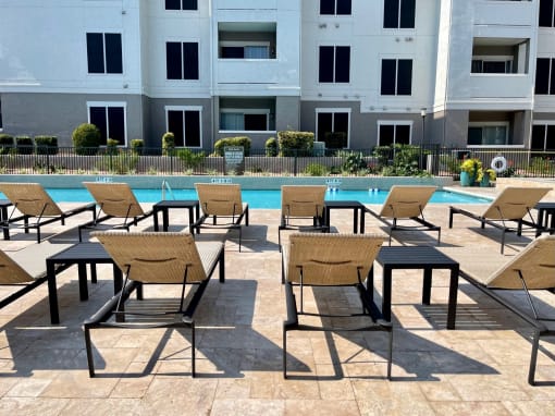 Pool with lounge chairs at Stonelake at the Arboretum, Texas, 78759