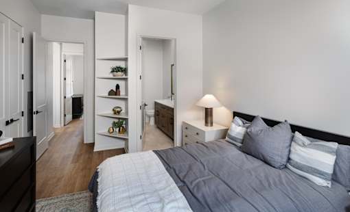 Bedroom with bed and nightstand at Aerie Blue Sage, Elkhorn, Nebraska
