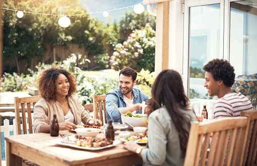 Group of people sitting around a table talking and eating at Aerie Blue Sage, Elkhorn, Nebraska
