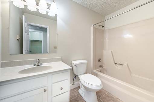 a bathroom with a sink toilet and a bath tub