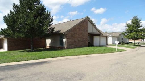an empty building with a road in front of it