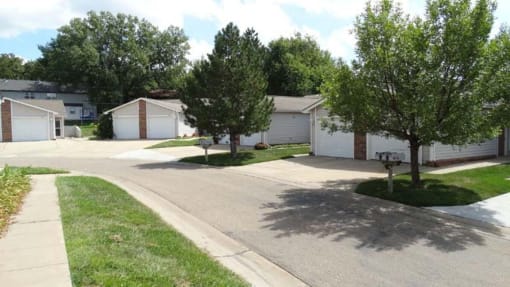 a street with a row of houses and trees