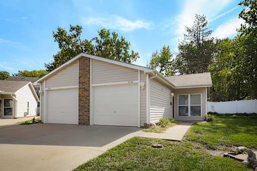 A two-car garage is attached to a house.