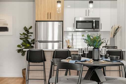 A Kitchen And Dining Area at Podium Apartments, Calgary, AB